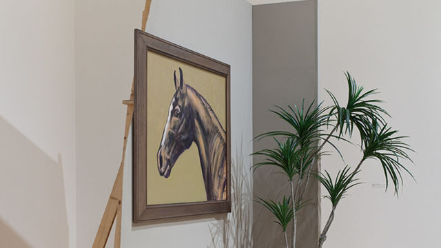 an installation with a plant, a painting hanging on a broken wall