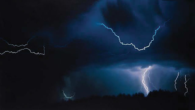 Lightning striking in the dark sky