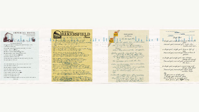 Four handwritten sheets of paper displayed on the wall in a row.
