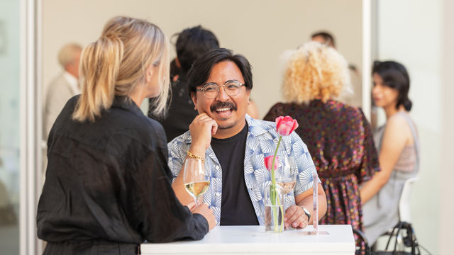 Visitors enjoying drinks at the 2022 summer exhibitions opening