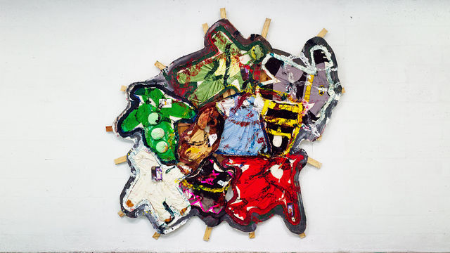 Oddly shaped painting covered with kids Halloween costumes