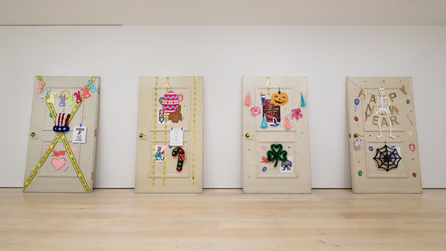 Four hugely oversized doors decorated in the style of the seasons