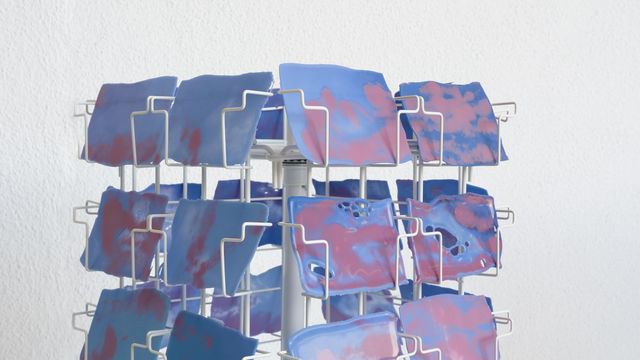 Postcard rack stocked with postcard-sized images of the sky