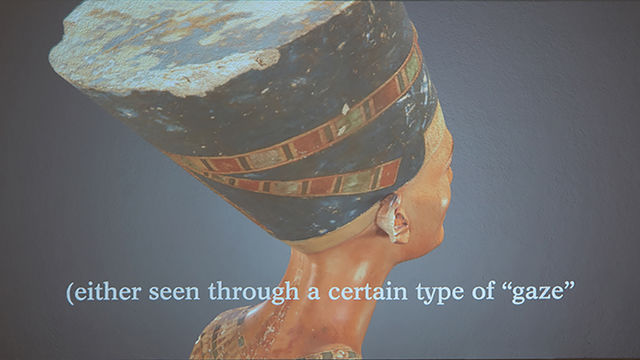 The back of an Egyptian bust sculpture, with a subtitle reading "Either seen through a certain kind of 'gaze'