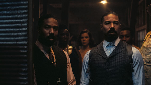 Identical twins played by Michael B Jordan look just off camera