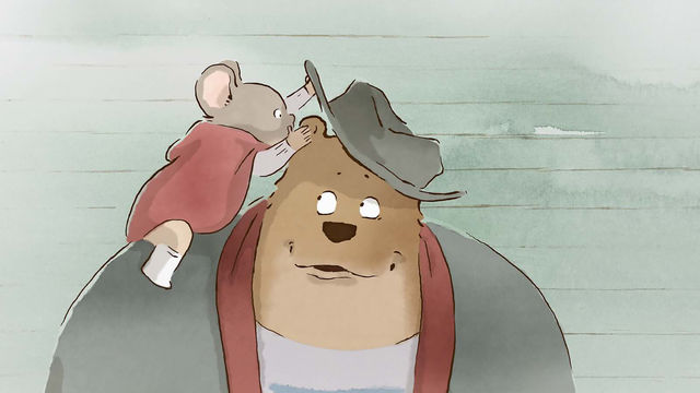 A cartoon mouse in a red cape sits on the shoulder of a bear, lifting the bear's hat to whisper in its ear