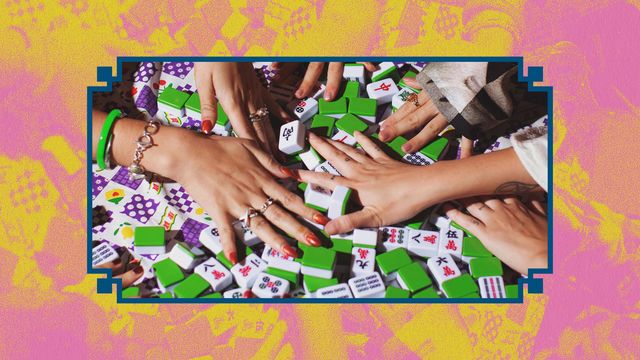 Close up of hands playing mahjong