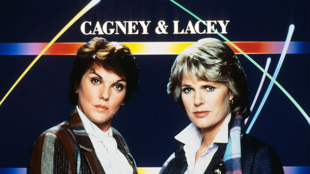 Two women with short hair stand in front of a graphic background reading CAGNEY & LACEY