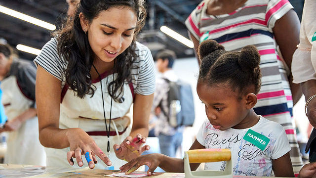 Families created prints celebrating their neighborhoods in a workshop conceived by artist Olga Koumoundouros at Family Day: Kids for Peace. 