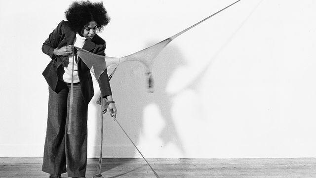 Senga Nengudi setting up for a performance of "RSVP X" in her Los Angeles studio, 1976