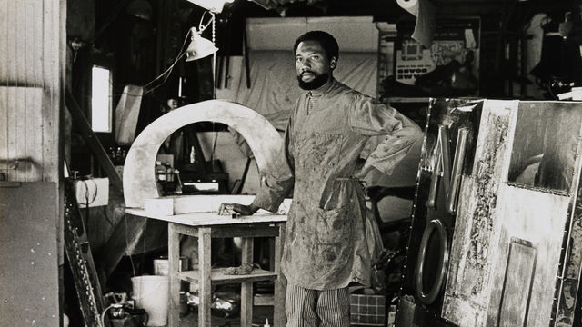 John Outterbridge in his Los Angeles studio with "No Time for Jivin',"1969, at right, 1970