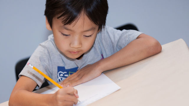 Kid writing poem