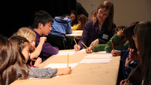 Kids work on writing in an 826LA writing workshop at the Hammer Museum.