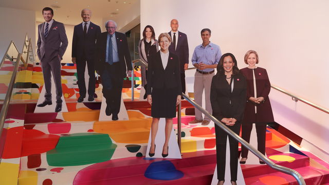 Cardboard cutouts of several 2020 Democratic candidates stand on the Hammer's lobby staircase.