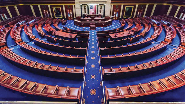 Empty chairs in a semi-circle around a podium