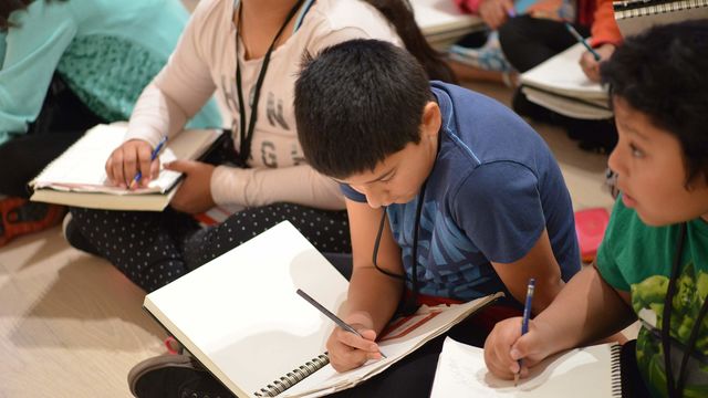 Kids writing in the galleries