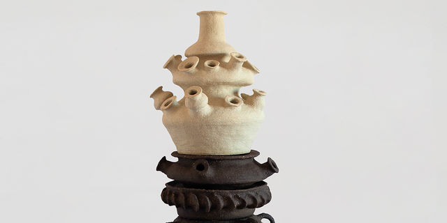 Large, stacked ceramic in black and white with multiple mouth/earpieces