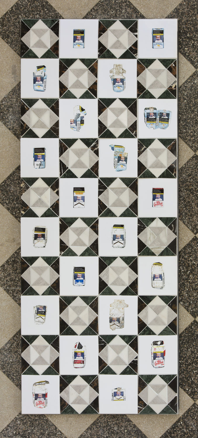 Geometric tiles decorated with cigarette packs with pictures of a baby smoking a cigarette on them