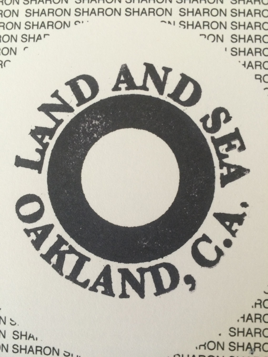 LAND AND SEA logo, stamped on all editions