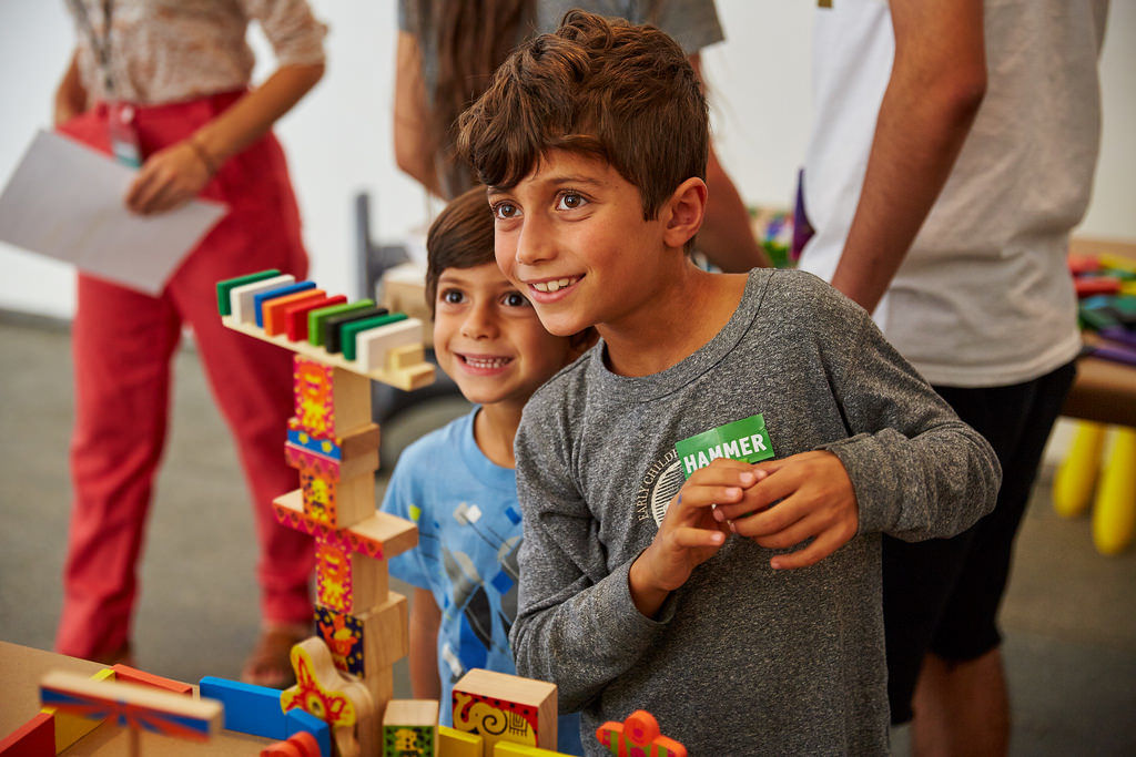 Arranging domino blocks to build a film set with Jibade-Khalil Huffman