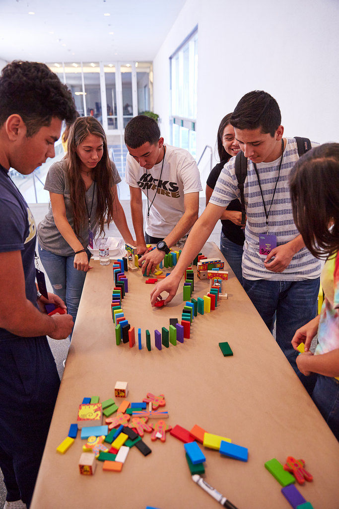 Arranging domino blocks to build a film set with Jibade-Khalil Huffman