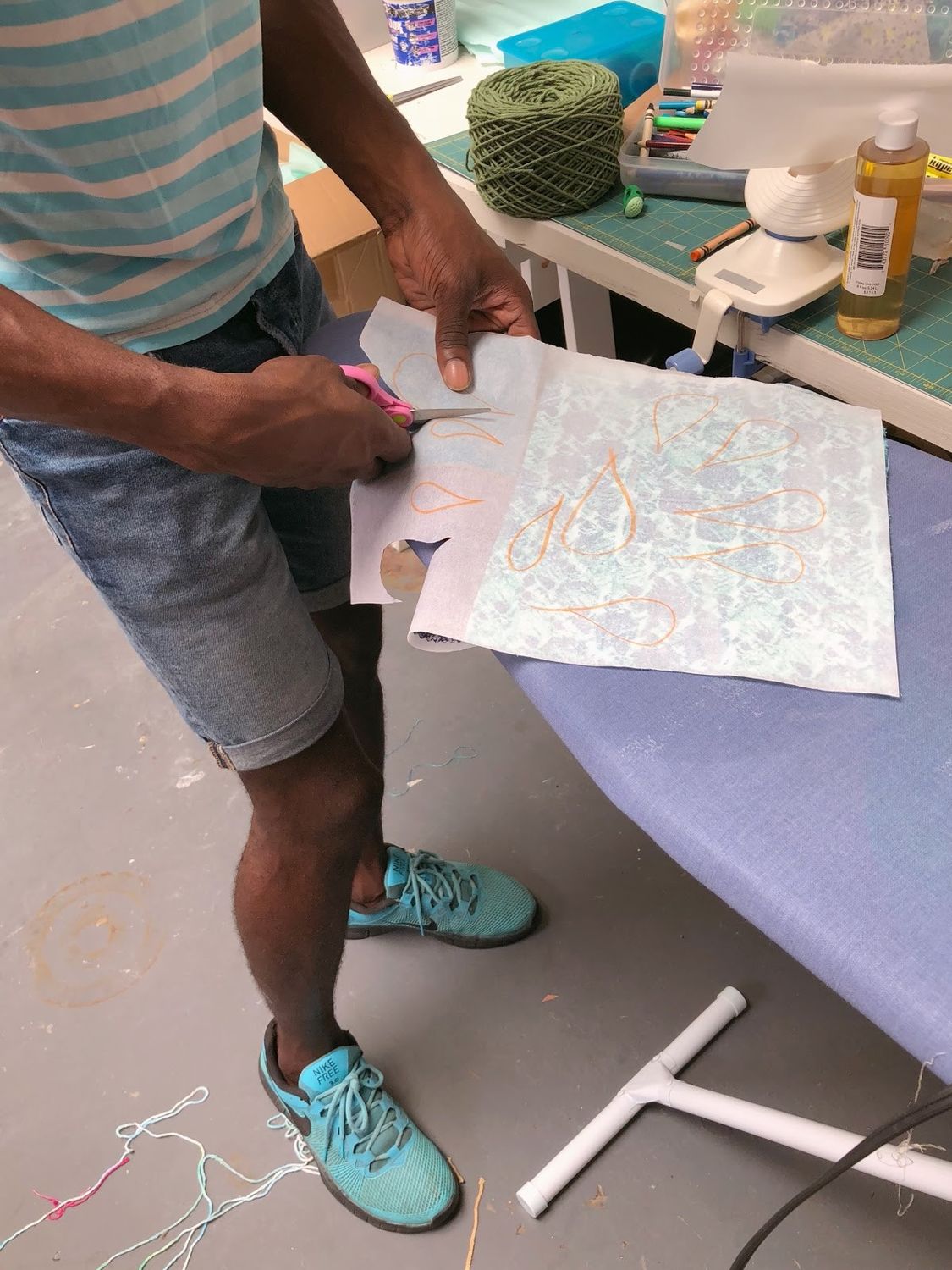 Diedrick working on a test of his Family Day project, protest quilts