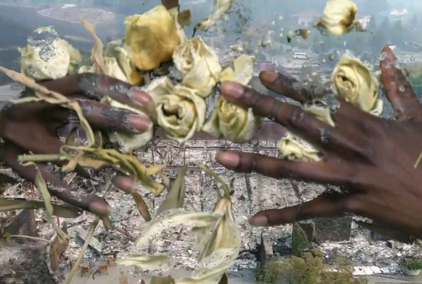 Two pairs of hands wrapped around flowers