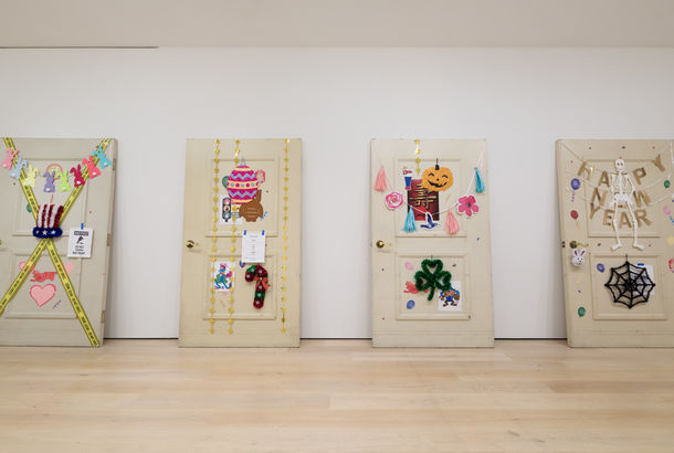 Four hugely oversized doors decorated in the style of the seasons
