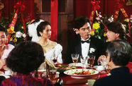 Still from the film The Wedding Banquet (1993) showing a wedding party at a dining table