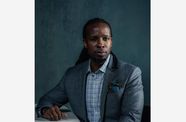 Portrait photograph in color of Ibram X. Kendi