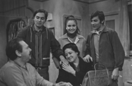 Still from the first episode of the television show Canción de la Raza (Song of the People) (1968), showing a Chicanx family gathered around a table