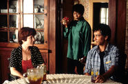Still from the film Passion Fish (1992) showing a three people talking in a kitchen