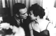 Still from the film Shadows (1961) showing a couple leaning in toward each other