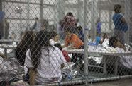 Women detained in a fenced in area at the Central Processing Center in McAllen, Texas, Sunday, June 17, 2018.