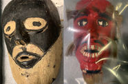 Images of two masks - on the left a wooden mask with black and white, and on the right a red mask with white teeth and hairy eyebrows, mustache and beard is seen underneath plastic