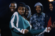 A group of people look at the camera