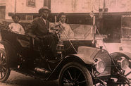 A vintage photograph of a Black family in a car