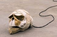 Brian Jungen, The Evening Redness in the West, 2006 (detail), baseballs, softballs, leather furniture, home theater system and DVDs, dimensions variable. 