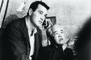 Rock Hudson on the left and James Wong Howe on the right on set. 