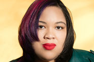 Portrait of a woman with a yellow background.