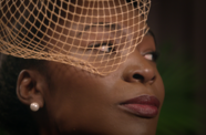 Closeup of a woman's face in a veil. 
