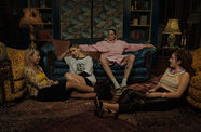 Still from the film "Bodies Bodies Bodies" (2022), showing four twenty-somethings relaxing in a living room