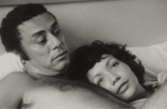 Man and woman lay in bed together