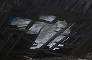 Dark-hued painting of a view of the sky through a hole in a roof