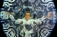 man smiles at camera through kaleidescope filter
