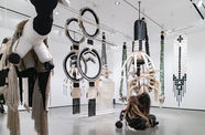 Eric-Paul Riege performs among his woven sculptures