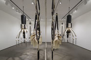 Art piece made of wood and rope hangs