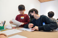 Two kids participate in an art activity