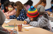 Kids write on paper 