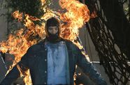 A man in a mask is on fire